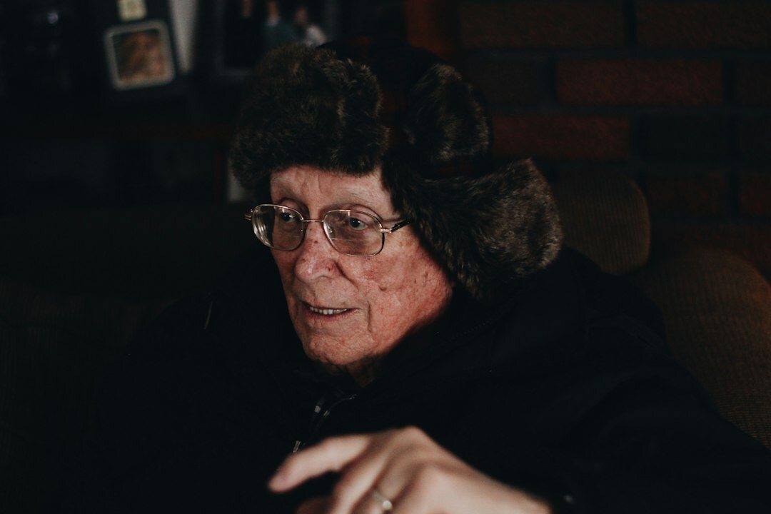 Studio portrait of a German woman sociologist with glasses