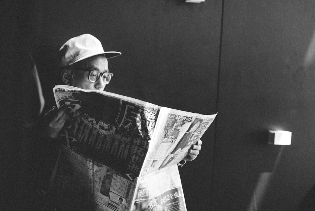 person reading newspaper